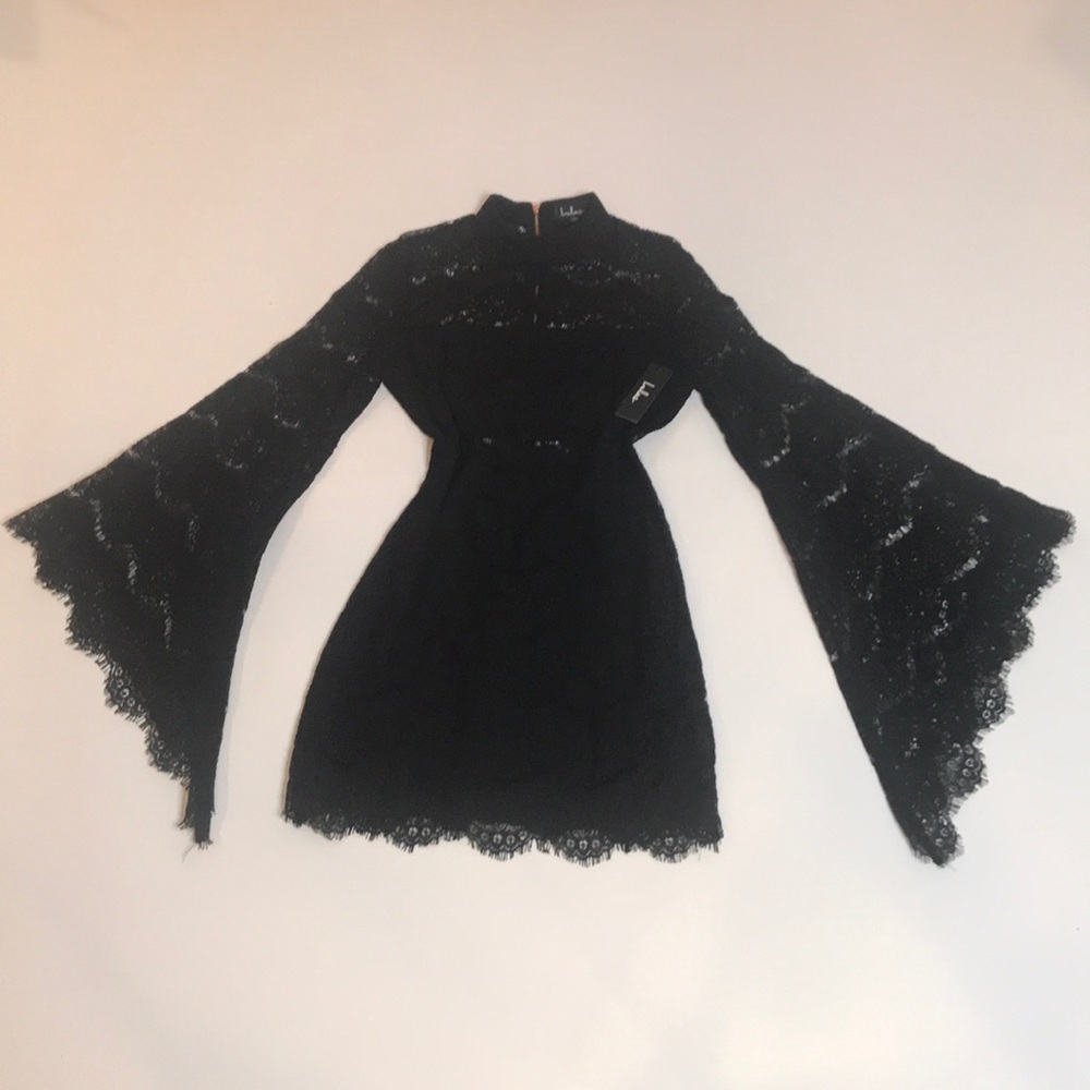 Black lace mini dress with bell sleeves.